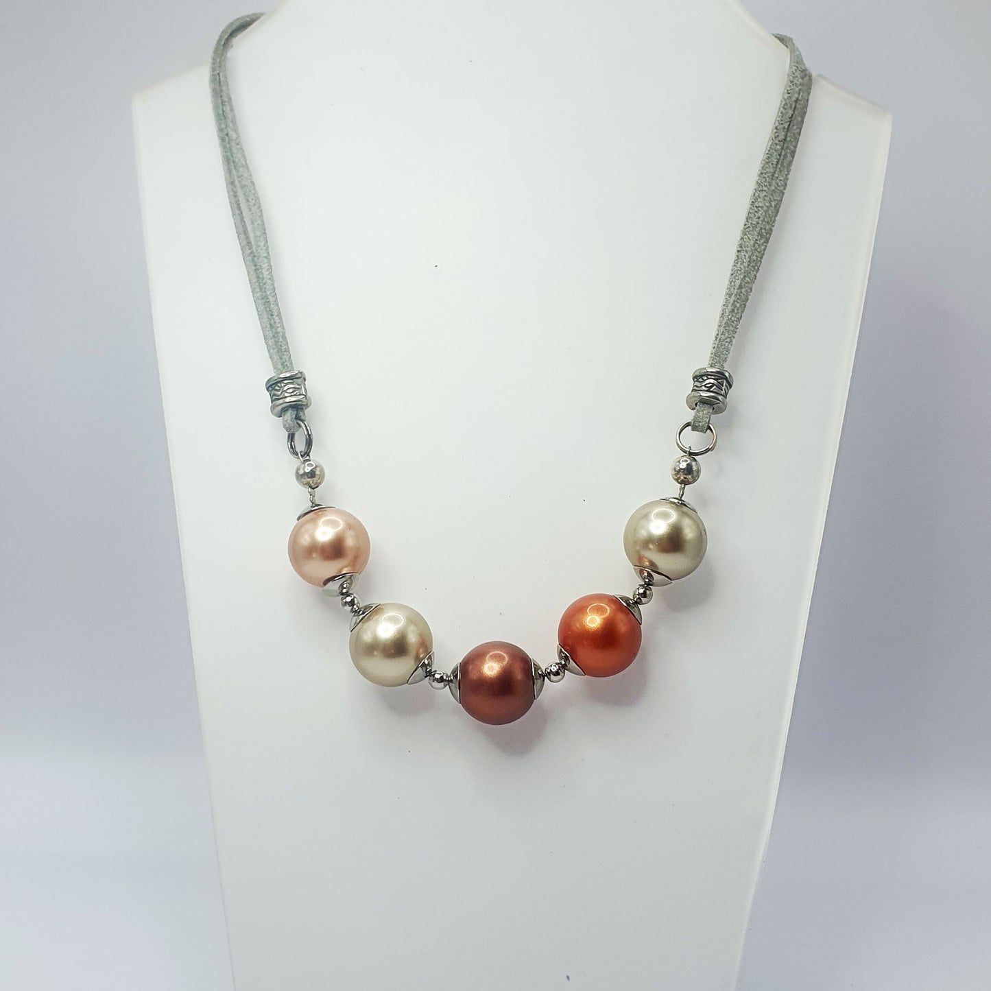 Glass pearl crescent necklace in bronze tones