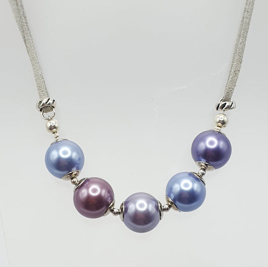 Glass pearl crescent necklace in purple tones
