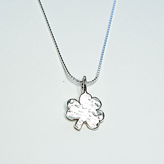 A delicate sterling silver shamrock on a silver chain