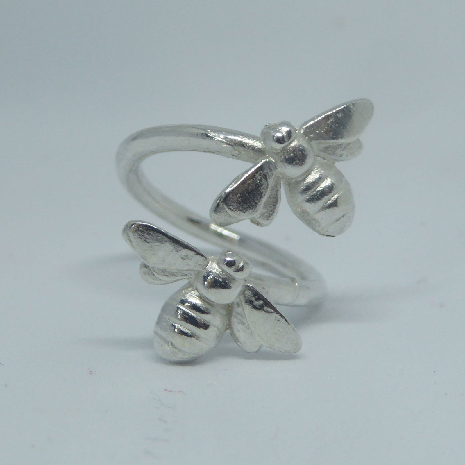 Sterling silver open ring with two bees